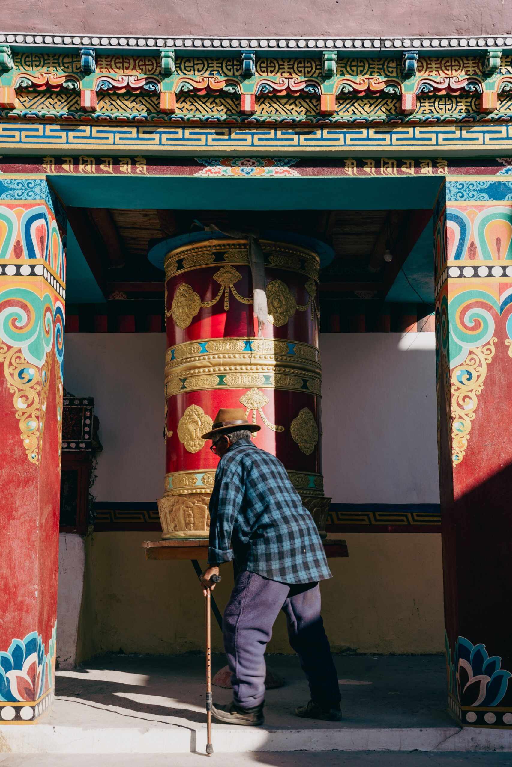 Abha le spinning prayer wheel on his way back home