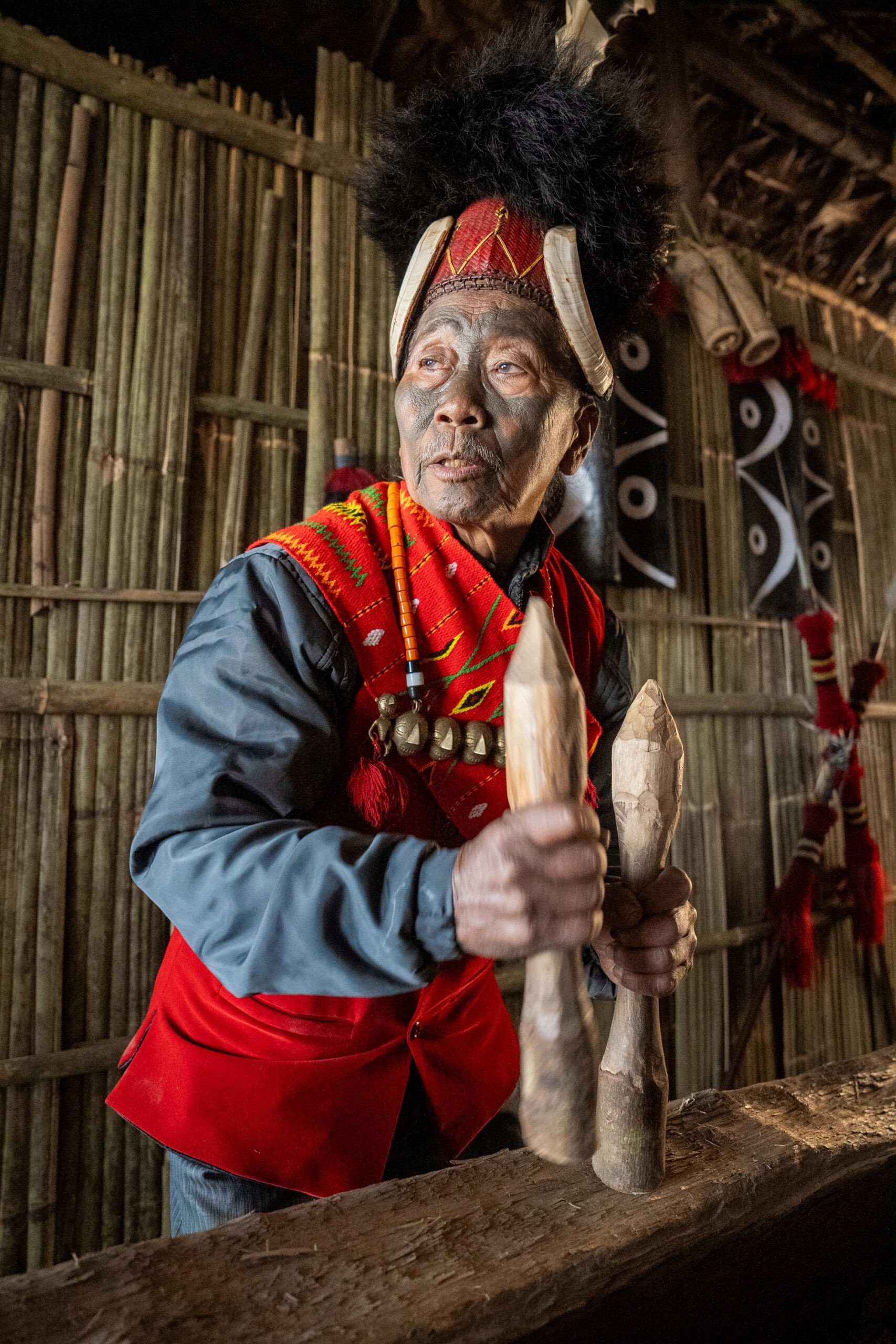 The Konyaks - last of the face tatooed headhunters playing log drum