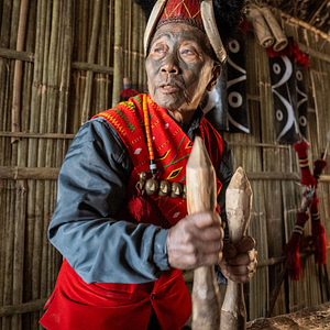 The Konyaks - last of the face tatooed headhunters playing log drum